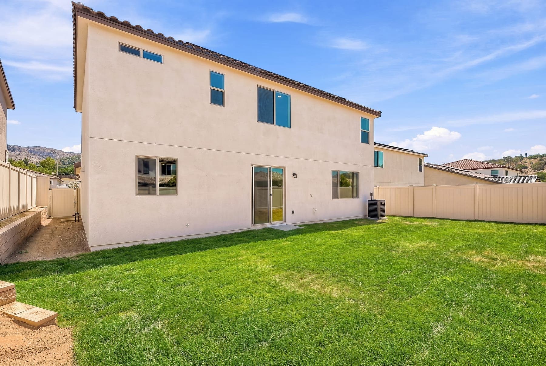 Escondido backyard — dirt lot versus lush green lawn